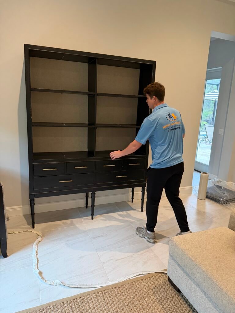 Senior Moving 9 Tampa Bay movers Merit and Muscle Movers wrapping furniture for protection