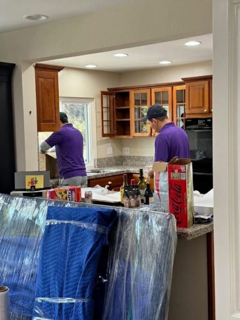 Movers packing a kitchen into boxes in Carrollwood, FL