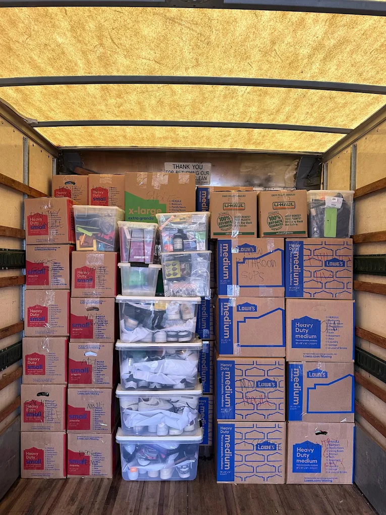 Long-Distance Movers in Brandon, FL 1 Boxes and bins stacked floor to ceiling in a moving truck