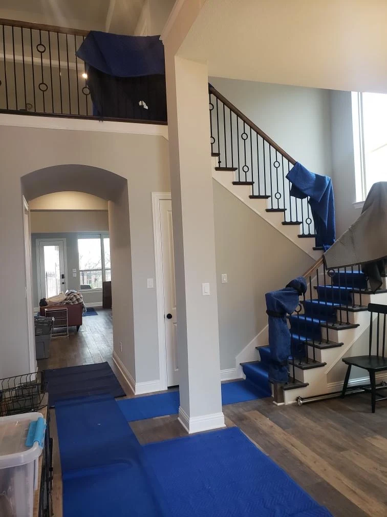 Wesley Chapel Movers 1 Staircase railings and floors protected with moving blankets and runners in Wesley Chapel, FL