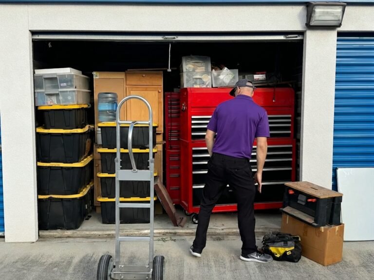 Mover unloading a storage unit with a hand truck in Temple Terrace, FL